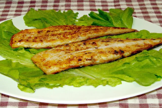 Plated Grilled Fish Fillets with Lemon and Herbs