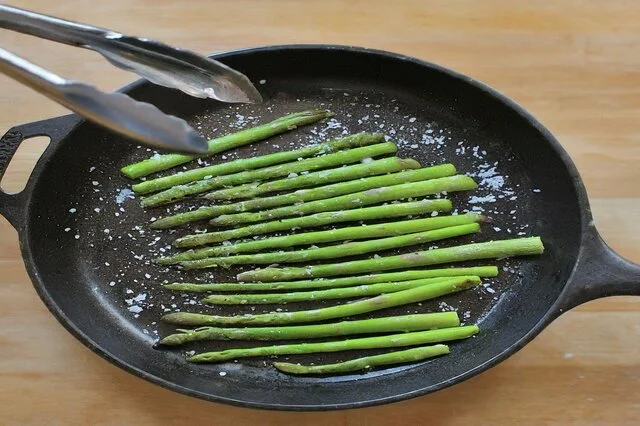 Asaparagus cooking in a pan