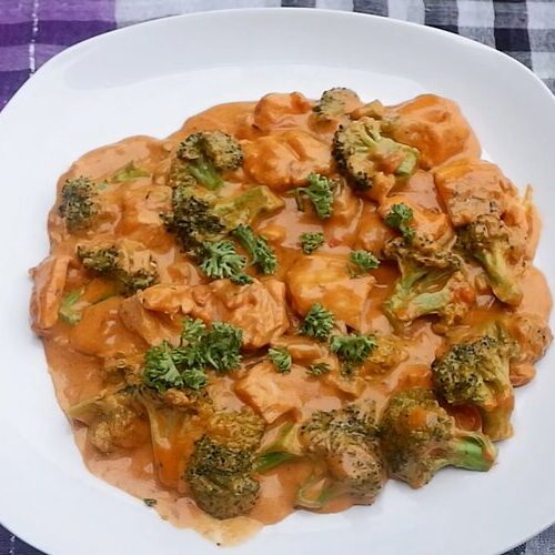 Plated Creamy Salmon with Broccoli in a Savoury Tomato Sauce